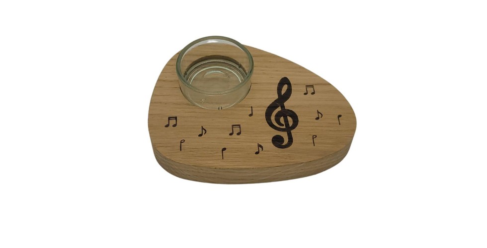 Tea light holder with treble clef and notes